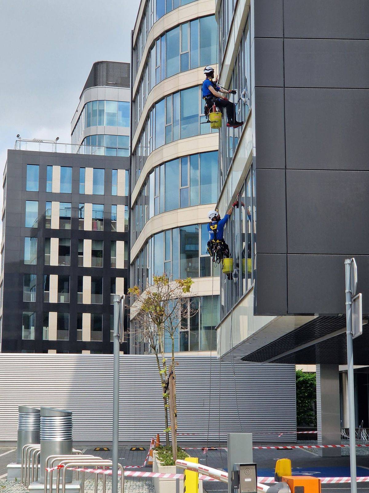 Window cleaning on a modern glass office building