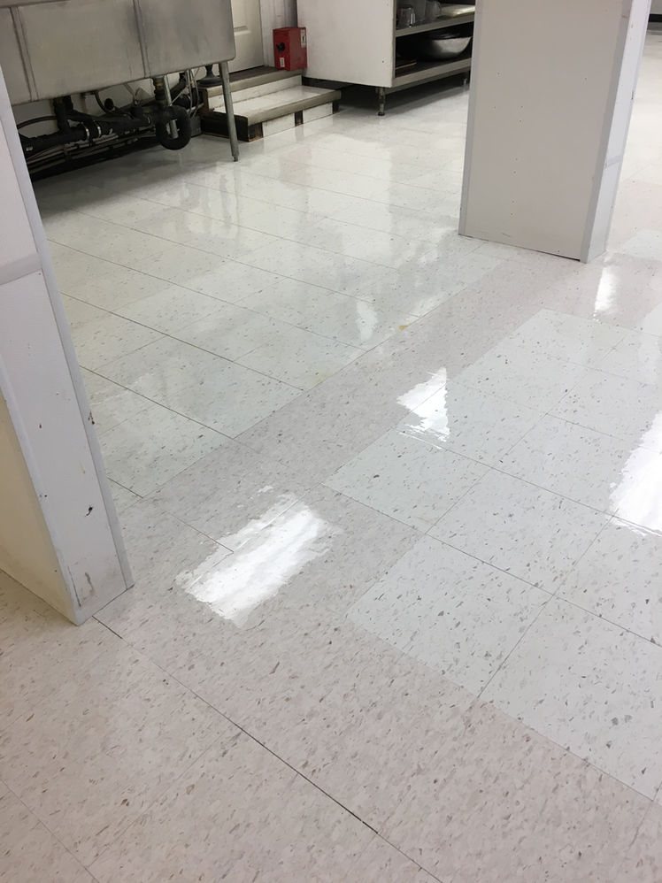 A freshly stripped and waxed tile floor by Prairie Building Maintenance