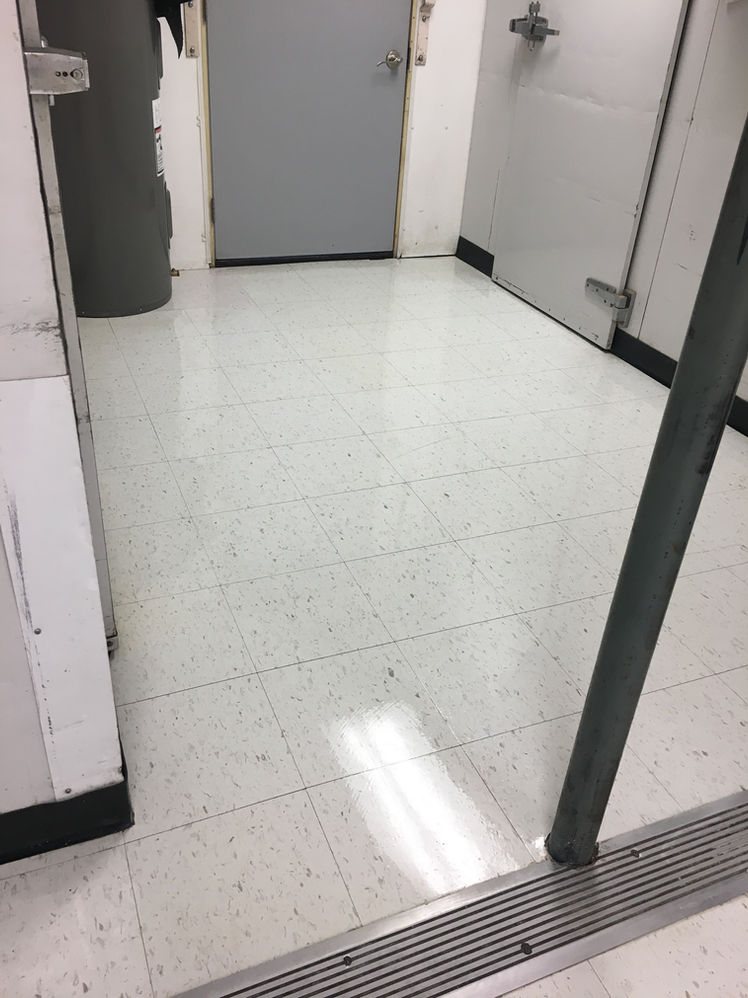 A freshly waxed floor in a turned-over unit, ready for its next tenant